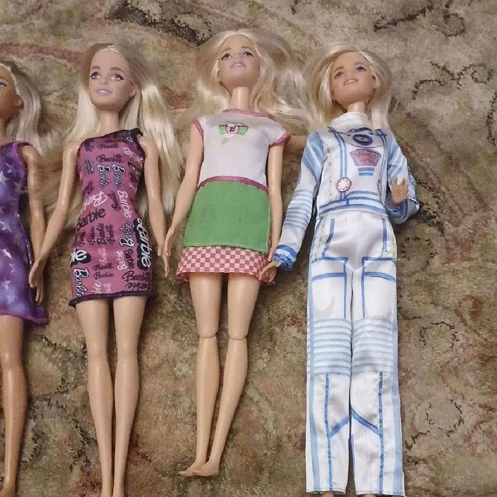 Set of Five Fashion Dolls with Various Outfits